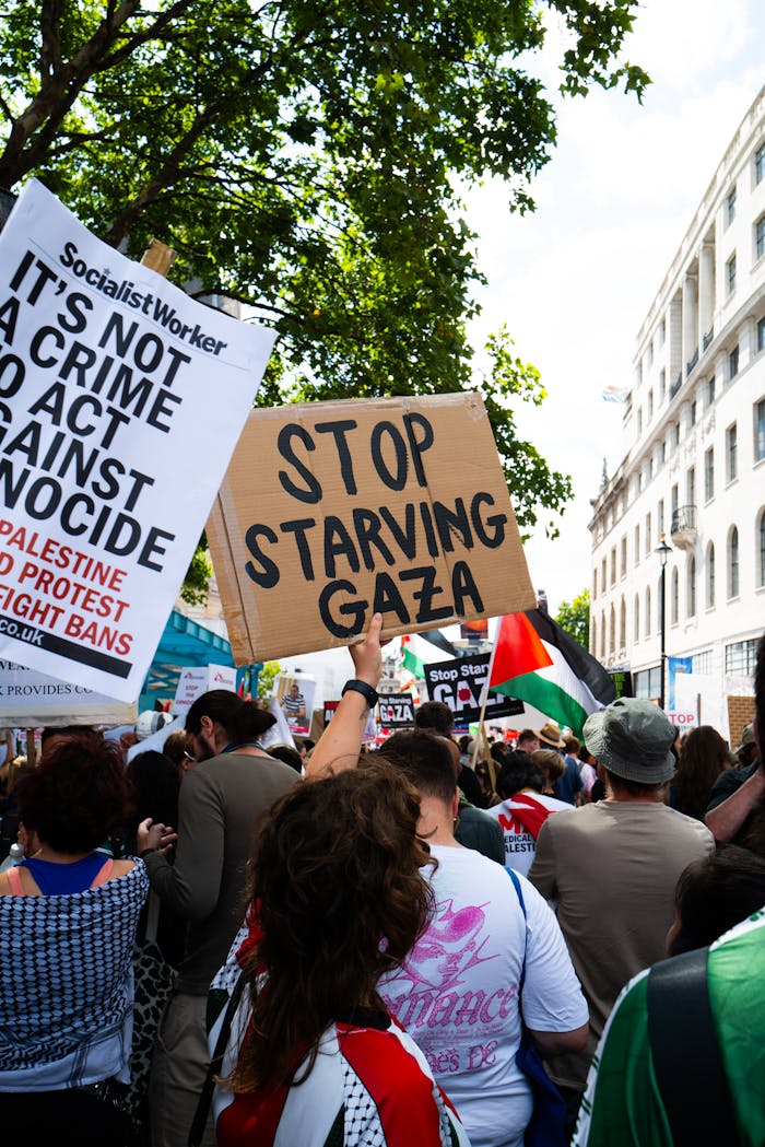 our-services-3 A demonstration in London with protesters advocating for Gaza. Visible protest signs and flags.